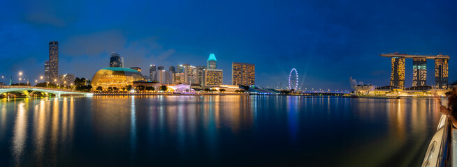 Fototapeta na wymiar Panorama of cityscapes of Marina Bay at night in Singapore
