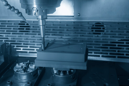 The CNC milling machine rough cutting the graphite electrode parts with solid ball end mill.