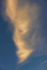 Fototapeta na wymiar Blue sky with sunset clouds