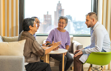 Man doctor with stethoscope service help support discussing and consulting care talk to sick senior asian woman patient in hospital,caregiver,elderly,recovery,illness insurance.healthcare and medicine