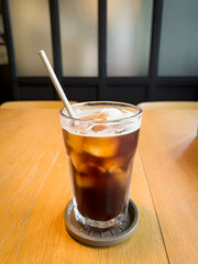 Cold Brew Iced Coffee on table, at office. Americano coffee menu in summer.