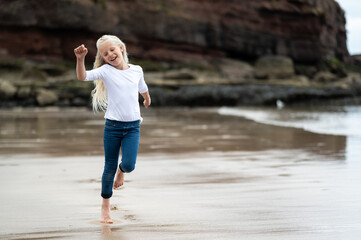 child walking on the beach