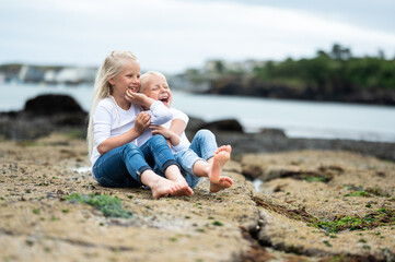 little child playing on the beach