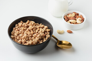 Granola in bowl on light background.