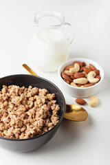 Granola in bowl on light background.