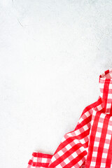 Kitchen tablecloth on white kitchen table. Food background with copy space.