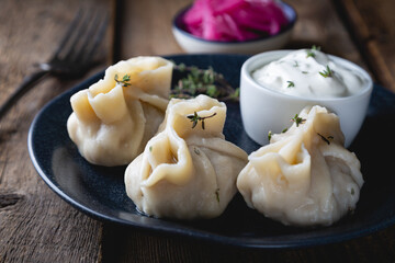Manti with sour cream and thyme