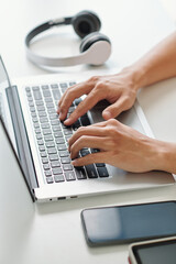 Obraz na płótnie Canvas Hands of developer working on laptop at his office desk