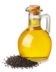 rapeseed oil in bottle with heap of rape seeds isolated on white