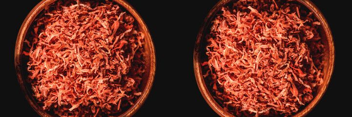 Fototapeta premium Dried carrots in wooden plate for cooking. Vegetable drying in dehydrator. Healthy and healthy food. Banner.