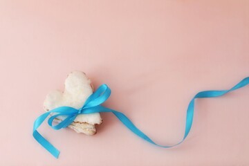 Blue ribbon on cookies,tape, band,gift, sweets, frosting, congratulations, greetings, background image, pink background, write, text, ideas, day, days, holiday, holidays, wallpaper for presentations