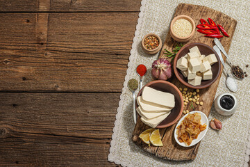 Set of ingredients for preparation Tofu. Fresh diced cheese, spices, herbs and soy sauce