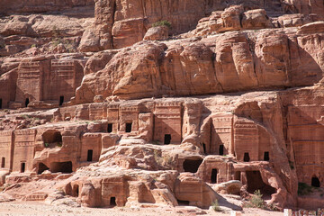 Street of facades in ancient Petra, archeological park in Jordan, Wadi Musa. Carving buldings in the mountains. 