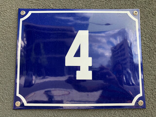 Beautiful blue metal sign that says number four