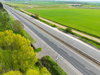 Drone view of part of anEnglish dual carriage way shown in the East Anglian countryside.