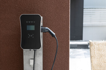 Progressive green energy-powered charging station concept for electric vehicle connected to home...