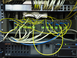 Close up network cables connected to switch in server rack