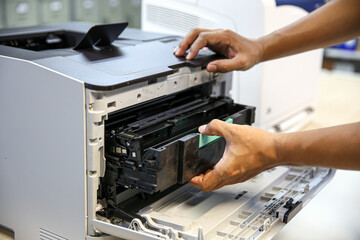 Technician hand open cover printer photocopier or photocopy to replace ink cartridges or fix paper...
