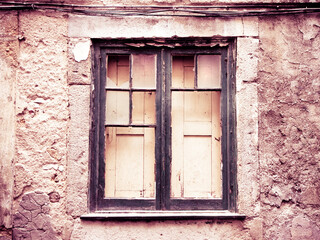 Old wooden window with broken glass