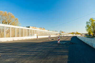 riga, latvia - april 20, 2023: repair work on the highway