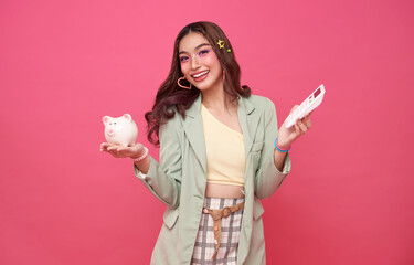 Young asian woman holding piggy bank and calculator saving money for retirement and investment...