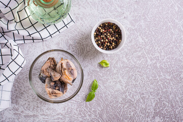 Canned tuna chunks in a bowl on the table top view