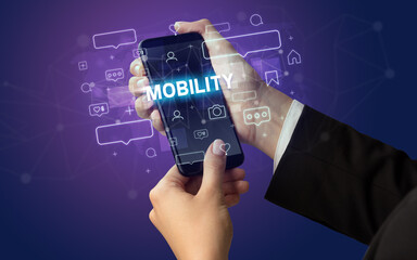 Hand using smartphone with social media concept