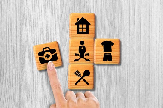 Set of wooden cubes with icons of human needs