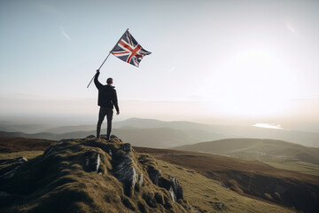 Obraz premium A man on top of a mountain holding a united kingdom flag, generative AI