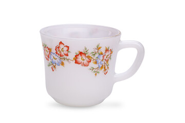 Beautiful empty white glass tea cup with colorful floral pattern isolated on white background.