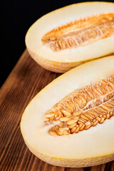 Melon halves on a wooden board
