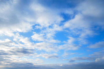 Dramatic sky with dark cumulus clouds. Menacing heavy clouds in the blue sky