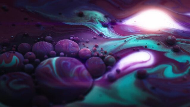 Flowing purple and blue liquid colors in an abstract background. 