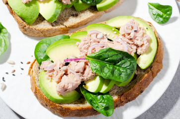 Tuna Avocado Toasts, Healthy Snack or Breakfast on Bright Background