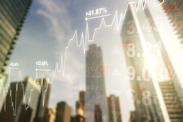 Double exposure of abstract financial graph on office buildings background, financial and trading concept