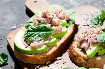 Tuna Avocado Toasts, Healthy Snack or Breakfast on Dark Background