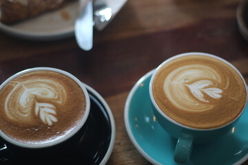 latte art on te wood table in the coffee shop