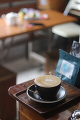 latte art on te wood table in the coffee shop