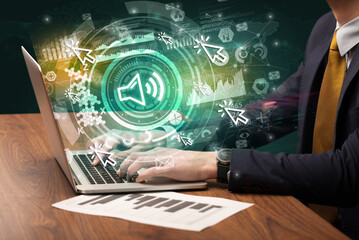 Business hand typing on a modern laptop