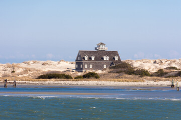 Deserted Oregon Inlet Life Saving Station on the water, Outer Banks, North Carolina