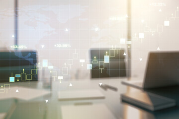 Abstract creative financial graph with world map and modern desktop with pc on background, financial and trading concept. Multiexposure
