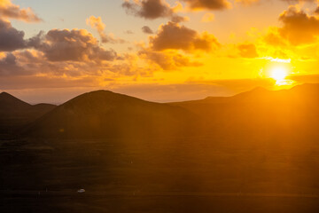 Amazing sunset over El Cuervo Volcano, in Lanzarote, Canary Islands,  Spain