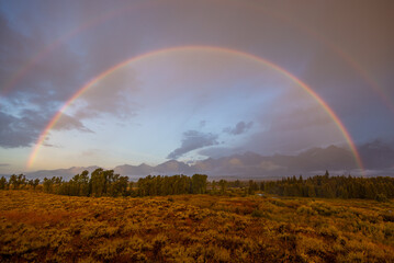 Obraz na płótnie Canvas Autumn Landscape in the Tetons in a Storm with Rainbow