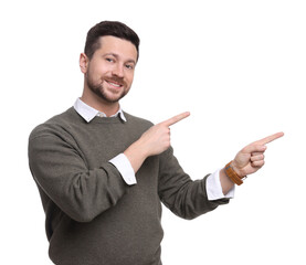 Portrait of handsome bearded businessman pointing at something on white background