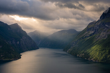 Dramatic sunbeam from the clouds over the Geirangerfjord,  Norway