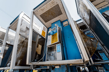 Old and dirty street phones at the city landfill
