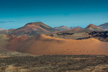 Fototapeta na wymiar Volcanic landscape of Timanfaya National Park, Lanzarote, Canary Islands, Spain