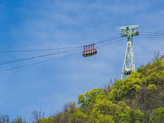Gondola bubbles against the blue sky. Cable car taking tourists to Fort de La Bastille in Grenoble,...
