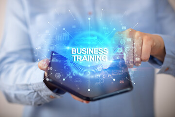 Businessman holding a foldable smartphone, new business concept