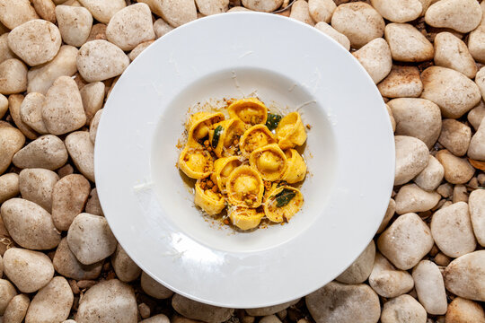 Italian Capelletti meal close up rock background